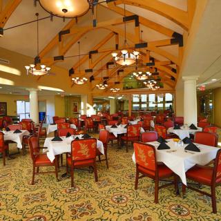 An elegant restaurant dining area with neatly set tables and stylish decor.