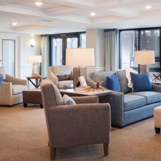 A modern living room with comfortable seating and elegant lighting.
