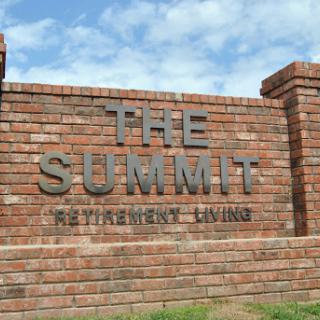 Entrance sign for The Summit Retirement Living.
