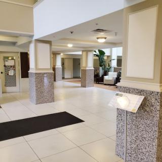 A spacious and modern lobby featuring elegant design and comfortable seating areas.
