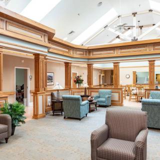 A spacious interior waiting area with comfortable seating and abundant natural light.