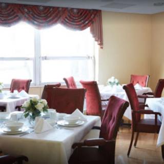 A well-arranged dining area with tables set for guests.