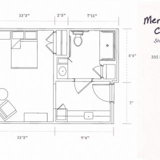 A detailed floor plan depicting a compact living space with bedroom, bathroom, and sitting area.