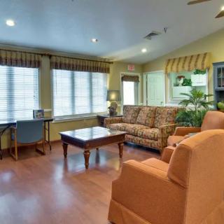 A cozy living room with comfortable seating and a warm ambiance.