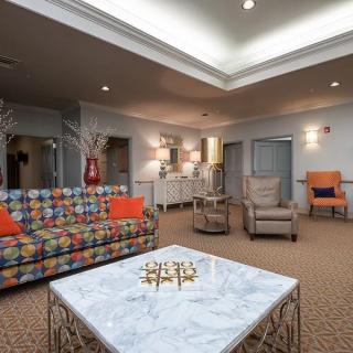 A modern living room with colorful furniture and stylish decor.