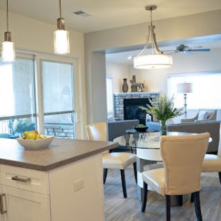 A contemporary kitchen and dining area featuring sleek furniture and a bright, inviting atmosphere.