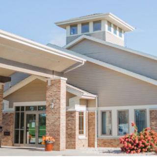 A modern community center showcasing a blend of brick and contemporary architectural elements.