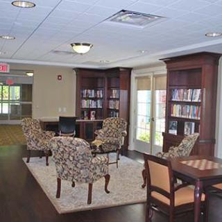 A cozy library with comfortable seating and bookshelves.