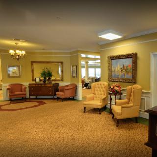 A cozy living room with comfortable seating and elegant decor.