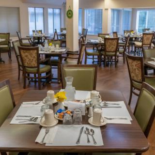 An elegant dining room with neatly set tables ready for guests.