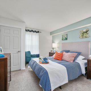 A cozy and modern bedroom with stylish decor and furnishings.