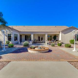 A spacious backyard with a patio and fire pit, ideal for outdoor relaxation.
