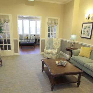 A cozy living room with comfortable seating and warm lighting.