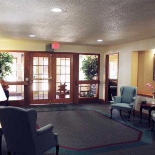 A cozy lobby with seating and natural lighting.