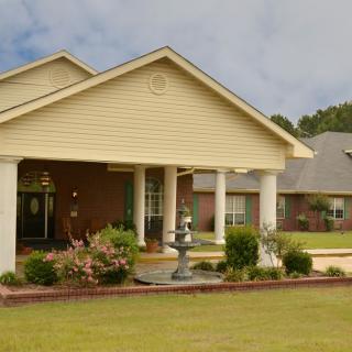 A suburban house with a well-maintained front yard and garden.