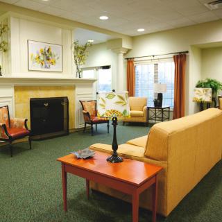 A cozy living room with comfortable seating and a fireplace.