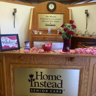 A warm and welcoming reception area at Home Instead Senior Care, decorated for Valentine's Day.