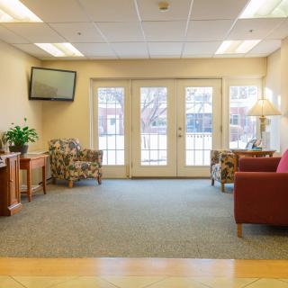 A cozy waiting room with ample seating and natural light.