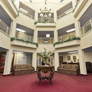 A spacious atrium lobby with elegant furnishings and architectural details.