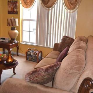 Cozy living room with a large sofa and elegant decor.