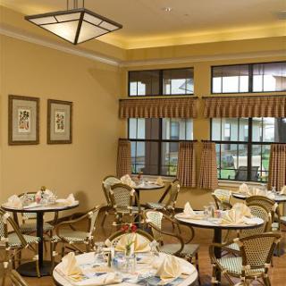 Elegant dining area with stylish decor and neatly arranged tables.