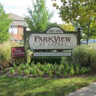 Entrance sign for ParkView at Laurel surrounded by greenery.
