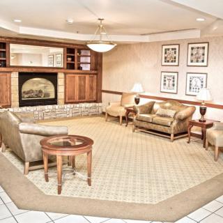 Cozy lounge area with elegant furnishings and a fireplace.