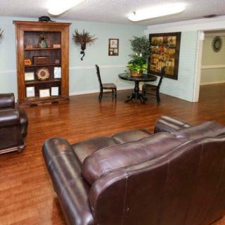 A cozy living room with comfortable seating and elegant decor.