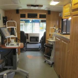 Interior view of a mobile medical unit equipped with healthcare devices.