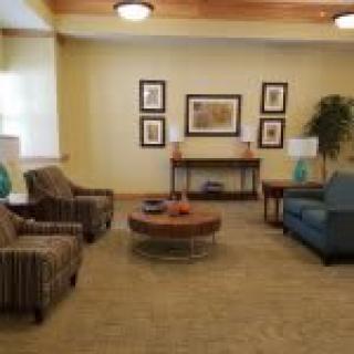 A cozy living room with comfortable seating and warm decor.