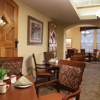 A cozy dining area with wooden furniture and warm decor.