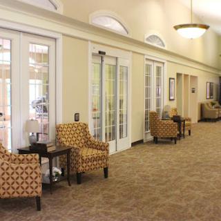 A spacious and welcoming lobby area featuring comfortable seating and a warm color palette.