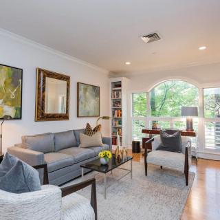 A modern living room with stylish furniture and abundant natural light.