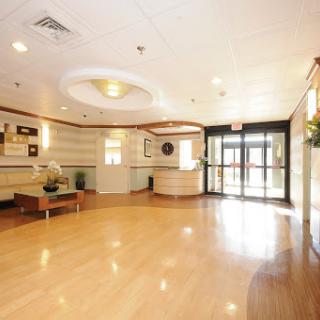 A spacious and welcoming lobby with modern furnishings and ample natural light.