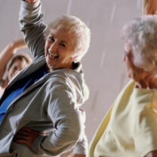 Seniors enjoying a group exercise session with enthusiasm.
