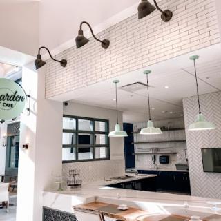 A bright and modern kitchen space featuring stylish lighting and clean lines.