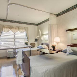 A serene and well-furnished hospital room designed for patient comfort.