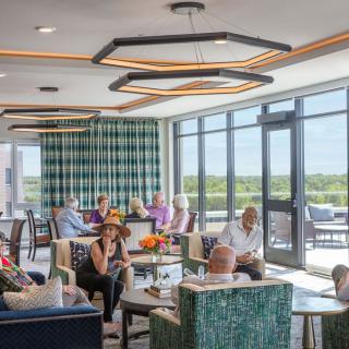 A modern lounge area where people are socializing and relaxing.