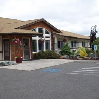 A well-maintained building with a welcoming entrance and designated accessible parking spaces.