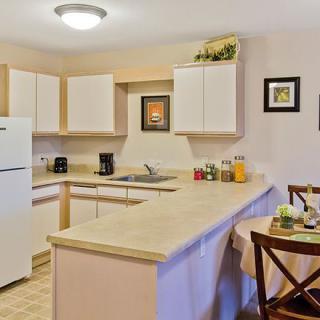 A cozy modern kitchen with a countertop and dining area.