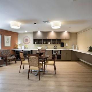 A modern kitchen and dining area with stylish furnishings.