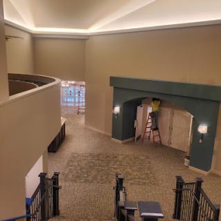 A spacious and well-lit lobby area featuring elegant architectural elements.