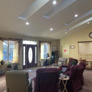 A cozy living room with comfortable seating and warm lighting.