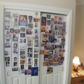 A collage of photographs adorning a closet door, capturing cherished memories.