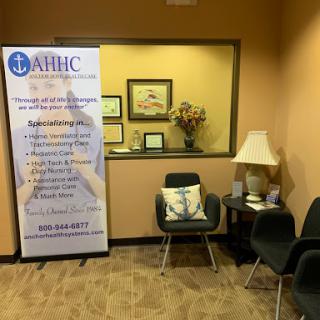 A cozy waiting area featuring a banner and comfortable seating.