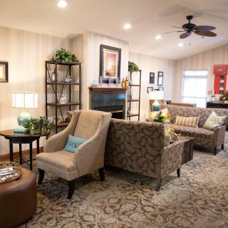 A cozy and well-decorated living room with comfortable seating and stylish decor.