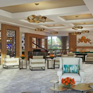 A modern and elegant lobby with stylish seating and decorative lighting.
