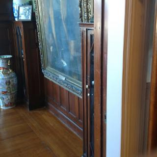 A glimpse of an elegant interior featuring wooden paneling and decorative art.
