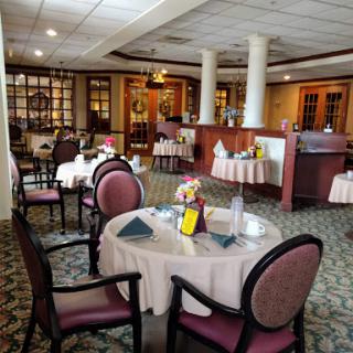 A beautifully arranged dining area in a restaurant, featuring elegant tables and chairs.