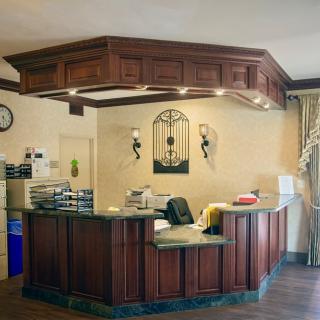A welcoming reception area with a wooden counter and decorative elements.